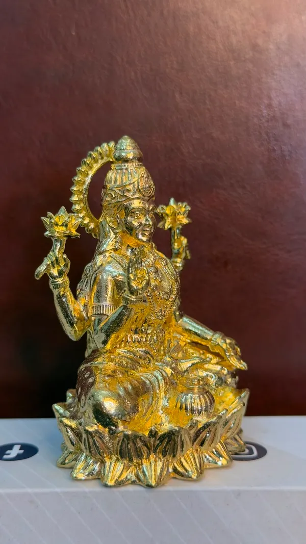 Goddess_Lakshmi_Seated_on_Lotus_-_Brass_Idol,_Gold_Finish