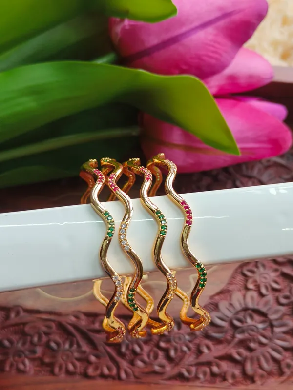 Gold_Tone_Wavy_Stone_Studded_Bangles_For_Women_(_Pack_Of_4_)