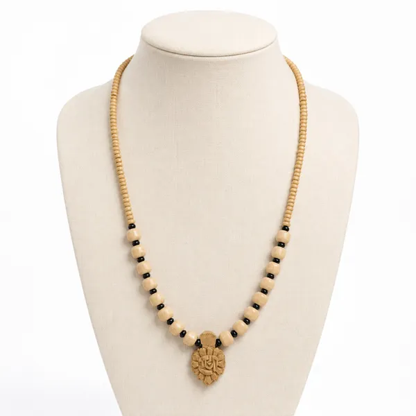 Natural_Tulsi_Beads_Necklace_with_Black_Spacers_and_Carved_Radha_Wooden_Pendant_|_Handcrafted_Devotional_Mala