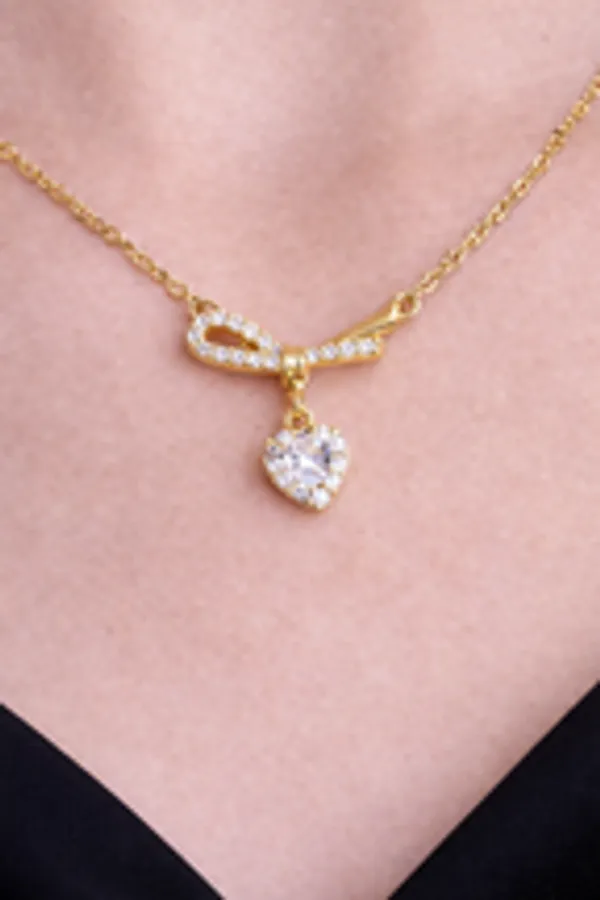 Gold_Ribbon_Bow_Necklace_With_Dainty_Heart_Drop