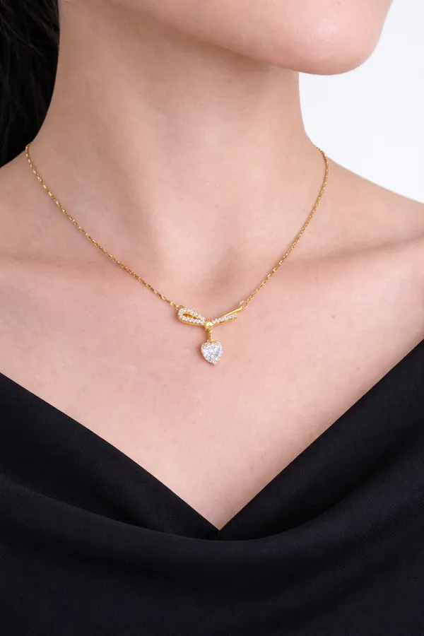 Gold_Ribbon_Bow_Necklace_With_Dainty_Heart_Drop