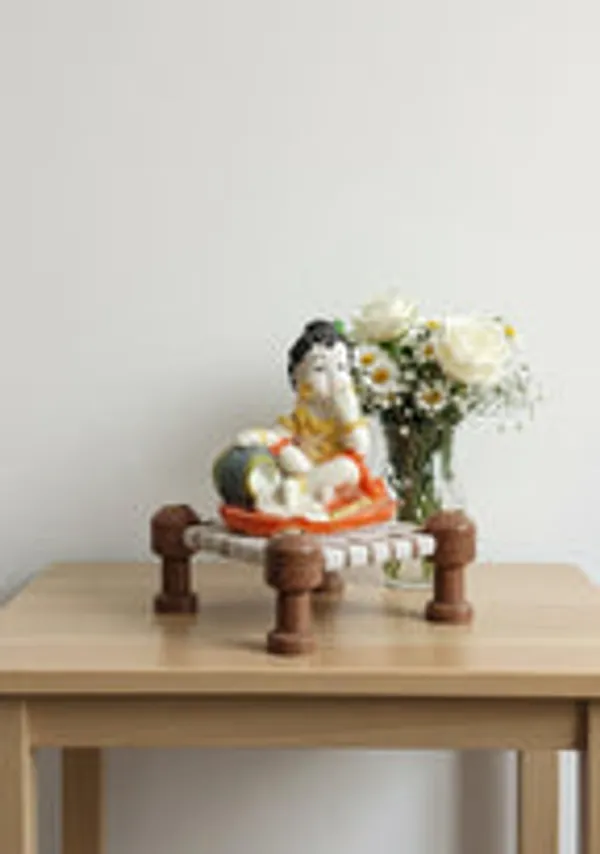Little_Krishna_Eating_Butter_On_Charpai_Handcrafted_Polyresin_Janmashtami_Decor
