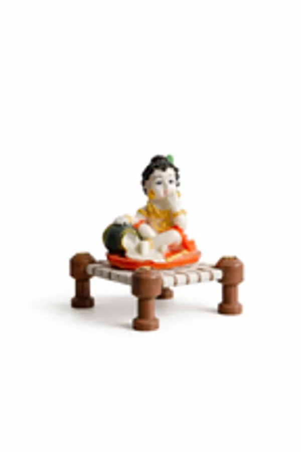 Little_Krishna_Eating_Butter_On_Charpai_Handcrafted_Polyresin_Janmashtami_Decor