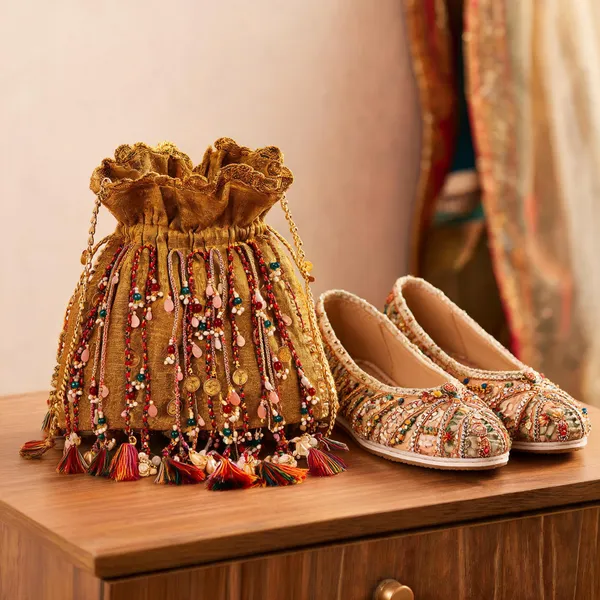 Golden_Brass_And_Alloy_Potli_Bag_For_Women