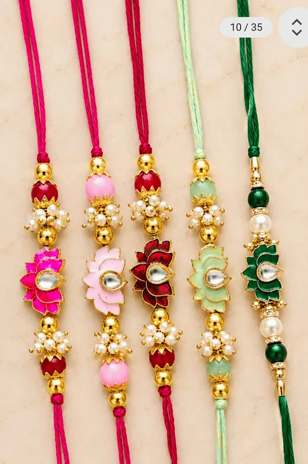 Premium_pearls_rakhi_kundan_rakhi_with_lotus_pendant_in_the_middle_with_small_oearls_all_around_looks_precious(Pack_of_1_psc)