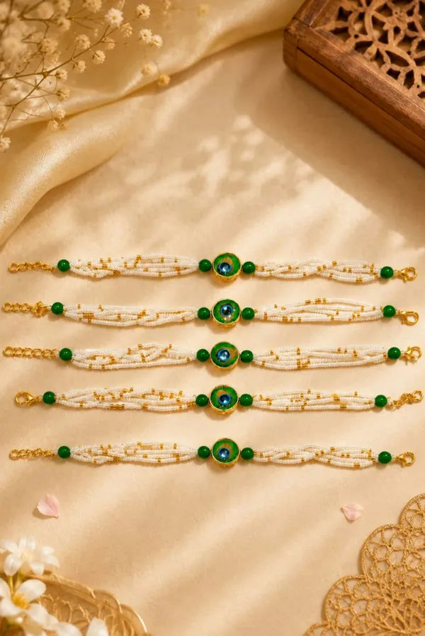 Special_pearls_bracelet_rakhi_with_premium_mor_pankh_broach_in_the_mid(Pack_of_1_pscs)