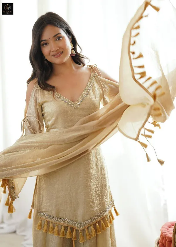 Luminous_Beige-Gold_Textured_Silk_Blend_Cold-Shoulder_Kurta_with_Sharara_&_Tasselled_Dupatta_Set