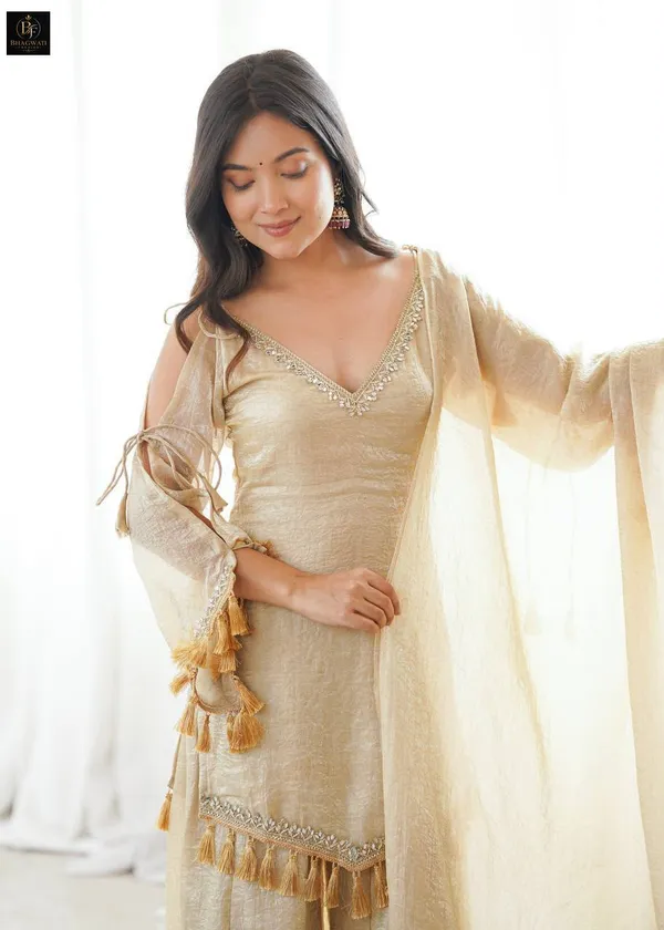 Luminous_Beige-Gold_Textured_Silk_Blend_Cold-Shoulder_Kurta_with_Sharara_&_Tasselled_Dupatta_Set