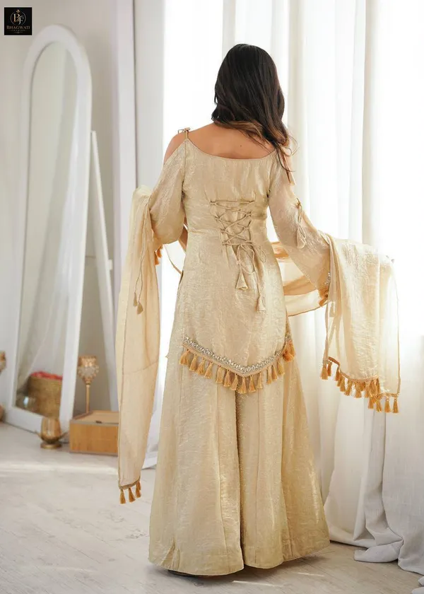 Luminous_Beige-Gold_Textured_Silk_Blend_Cold-Shoulder_Kurta_with_Sharara_&_Tasselled_Dupatta_Set