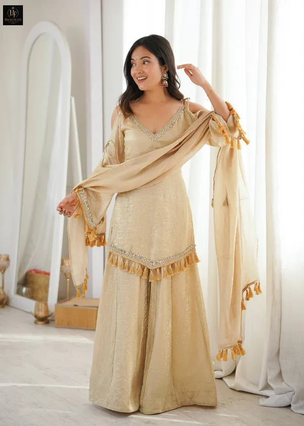 Luminous_Beige-Gold_Textured_Silk_Blend_Cold-Shoulder_Kurta_with_Sharara_&_Tasselled_Dupatta_Set