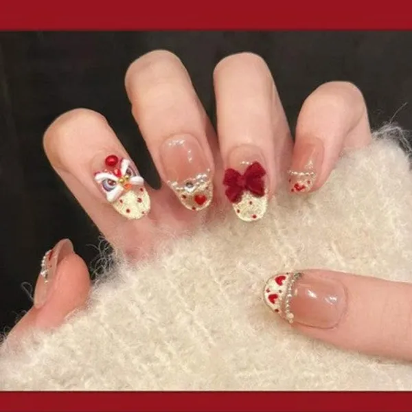 Lucky_Charm_Press_On_Nails_Nude_With_Red_Hearts_Bow_Accents