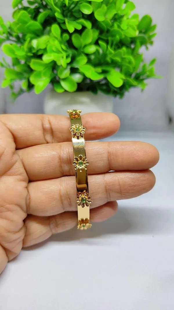 Gold_Floral_Bloom_Bangle_With_Emerald_Green_Accents