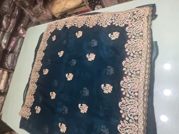 n_blue_saree_heavy_with_heavy_border_zari_stone_and_embrodery_and_butta_on_ful_saree
