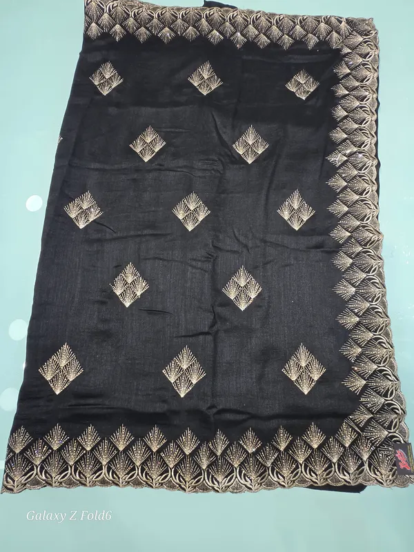black_saree_with_butta_and_border_work