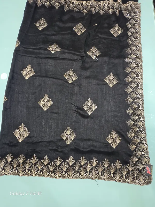 black_saree_with_butta_and_border_work