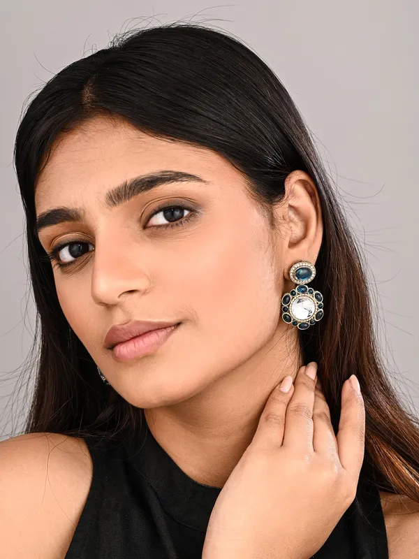 Statement_earrings_featuring_a_bold_circular_design_with_a_vintage_finish
