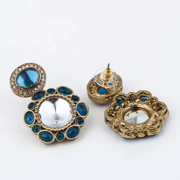 Statement_earrings_featuring_a_bold_circular_design_with_a_vintage_finish