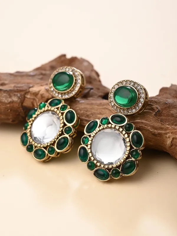 Statement_earrings_featuring_a_bold_circular_design_with_a_vintage_finish