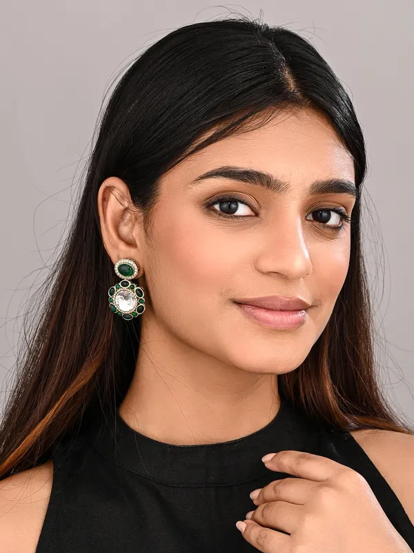 Statement_earrings_featuring_a_bold_circular_design_with_a_vintage_finish