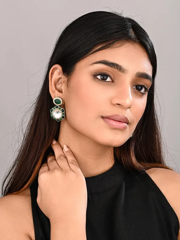 Statement_earrings_featuring_a_bold_circular_design_with_a_vintage_finish