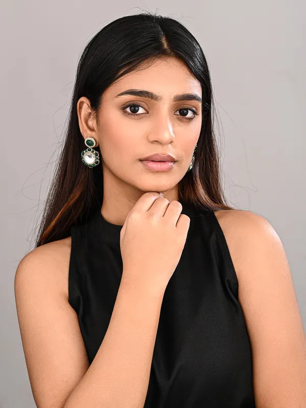 Statement_earrings_featuring_a_bold_circular_design_with_a_vintage_finish