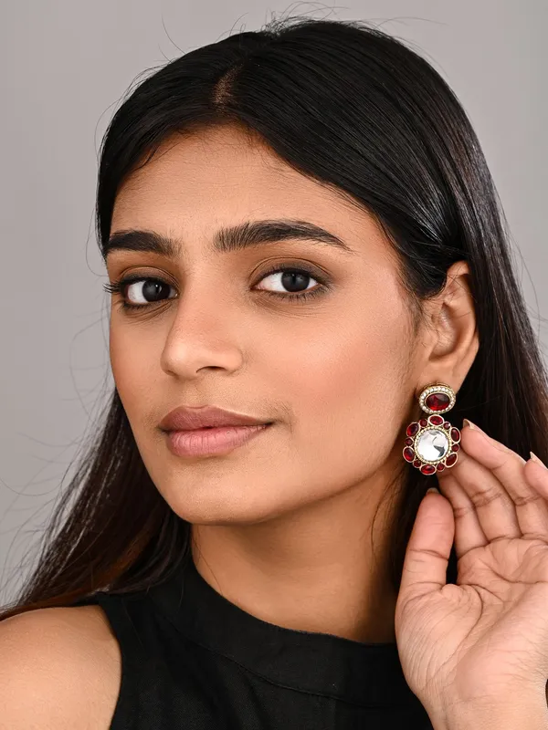 Statement_earrings_featuring_a_bold_circular_design_with_a_vintage_finish