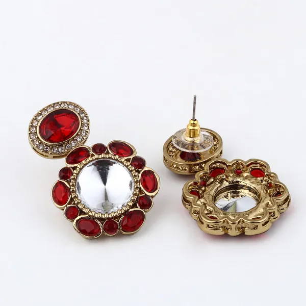 Statement_earrings_featuring_a_bold_circular_design_with_a_vintage_finish