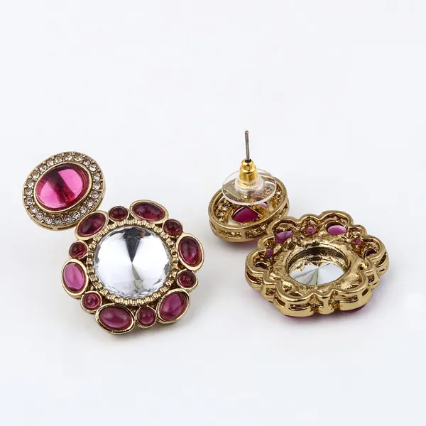 Statement_earrings_featuring_a_bold_circular_design_with_a_vintage_finish