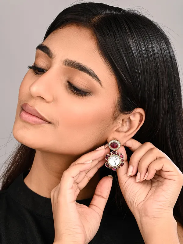 Statement_Earrings_Featuring_A_Bold_Circular_Design_With_A_Vintage_Finish