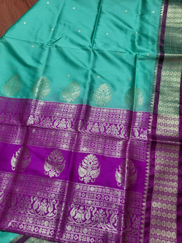 Sindhuja_Fashion_House_Woven_Banarasi_Pure_Silk,_Cotton_Silk_Saree_(Light_Green,_Purple)