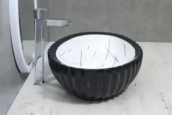 HISRE_Designer_Fluted_Round_Black_&_White_Marble_Ceramic_Vessel_Sink_For_Bathroom_Wash_Basin_Over_Counter_(19_x_13.5_x_5.5_Inch)_(Style_-_2)_CE3303_Table_Top_Basin_(Black_&_White)