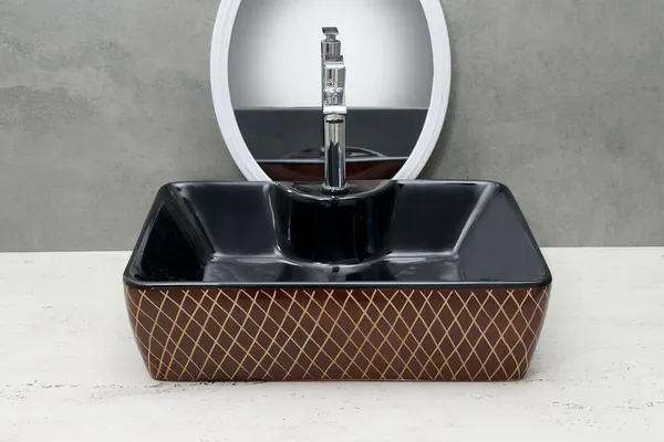 HISRE_Ceramic_Table_Top_Vessel_Sink_Wash_Basin_Oval_Shape_Over_Counter_Wash_Basin_For_Bathrooms_&_Living_Room_19_X_14_X_5_Inch_(RT604)_Table_Top_Basin_(Black)