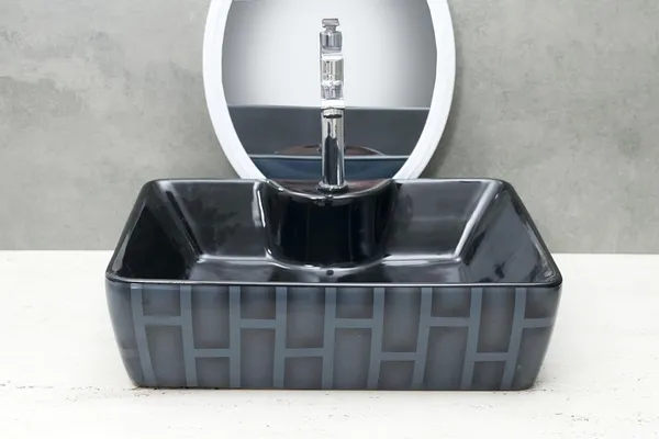 HISRE_Ceramic_Table_Top_Vessel_Sink_Wash_Basin_Oval_Shape_Over_Counter_Wash_Basin_For_Bathrooms_&_Living_Room_19_X_14_X_5_Inch_(RT606)_Table_Top_Basin_(Black)