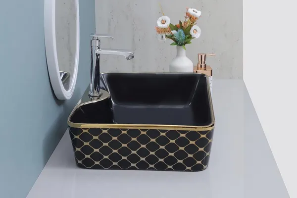 HISRE_Luxury_Ceramic_Tabletop_Wash_Basin_Black_Gold_Glossy_Rectangle_Bathroom_Sink_European_Style_Designer_Countertop_Vessel_Sink_for_Bathroom_(19x14x5_Inch)_G1112_Over_Counter_Basin_(Black_&_Golden)