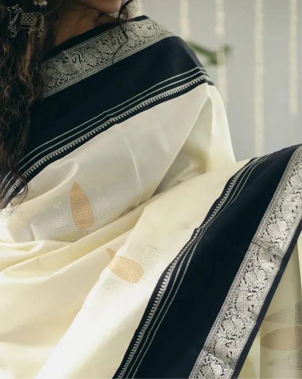 Cream_Silk_Printed_Saree_With_Black_Border_For_Women