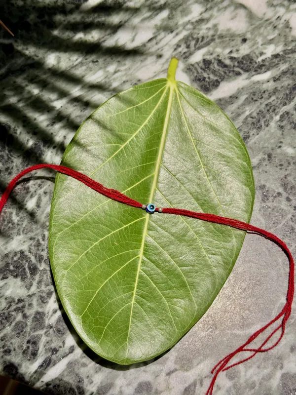 Red_Thread_Blue_Bead_925_Silver_Rakhi_For_Men