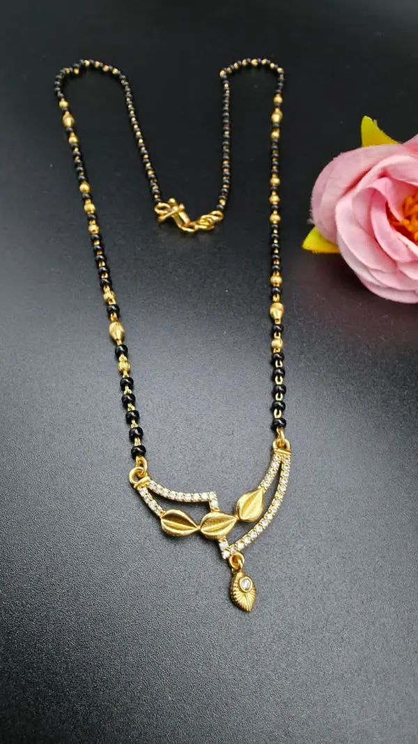 Bold_lines_meet_delicate_drops_in_this_modern_statement_piece.