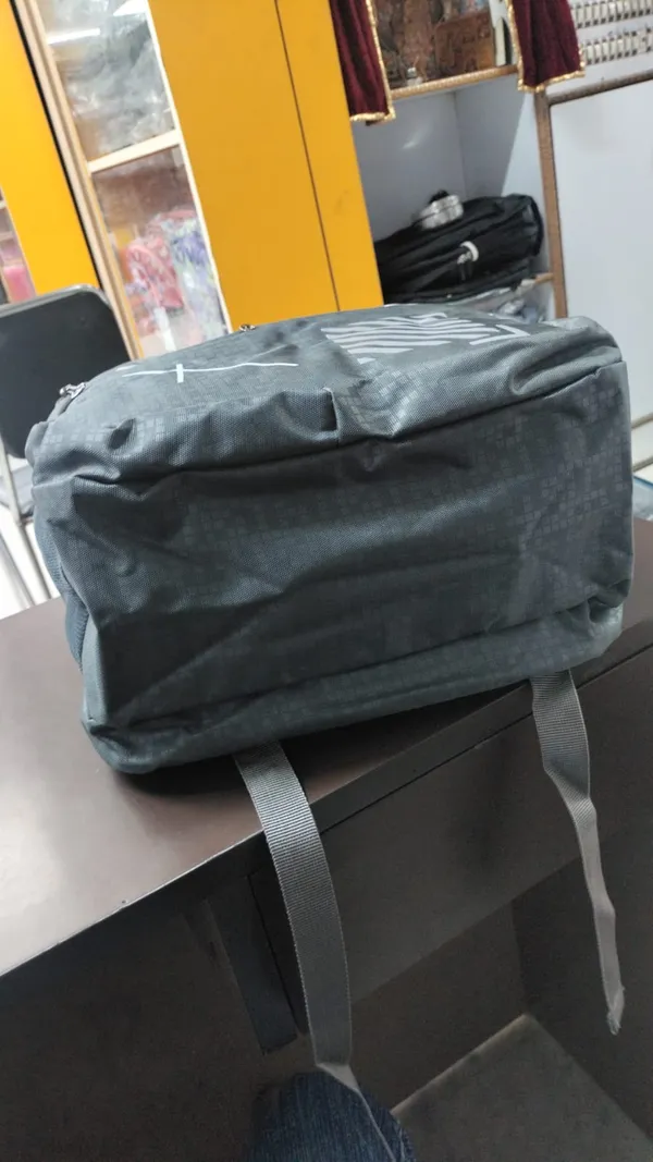 Black_Printed_Backpack_With_Front_Zip_Pocket