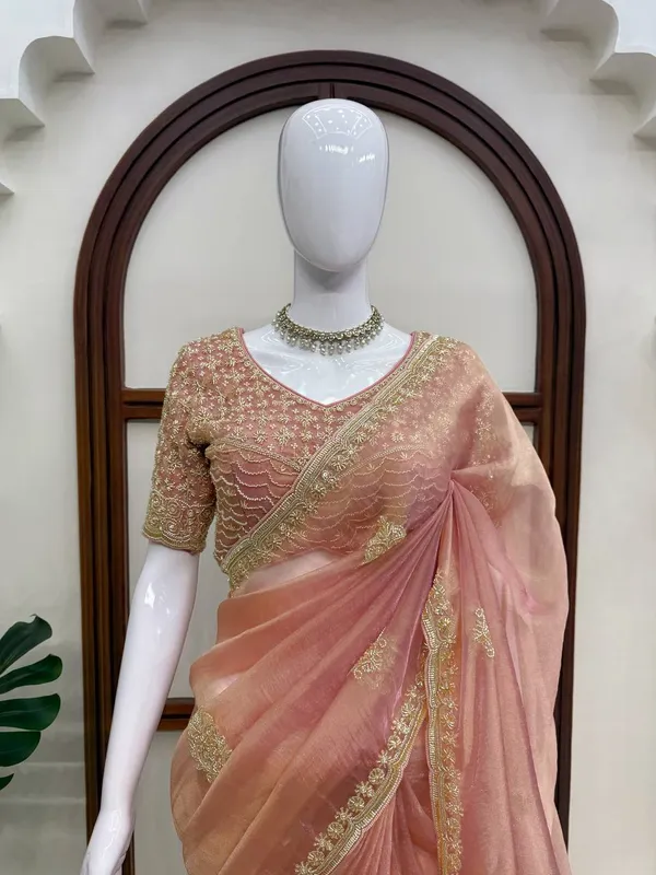 Fall_in_love_with_this_stunning_saree_in_an_eye-catching_shade,_crafted_with_finesse_and_rich_detailing._A_perfect_blend_of_grace_and_glam!