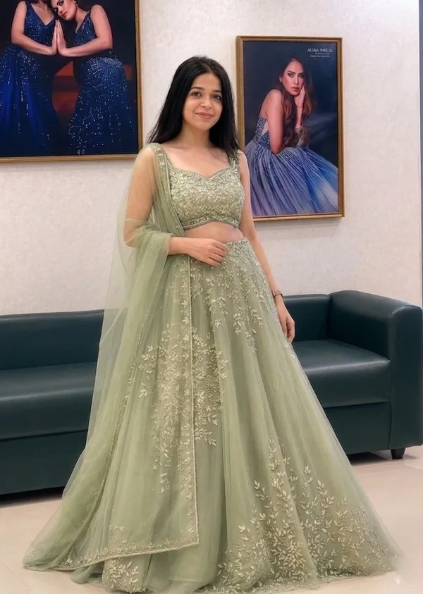 Sage_Green_Net_Sleeveless_Floral_Embroidered_Lehenga_Choli_For_Women