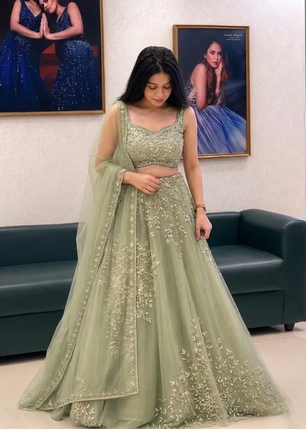 Sage_Green_Net_Sleeveless_Floral_Embroidered_Lehenga_Choli_For_Women