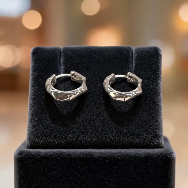 Sculptural_Twist_Silver_Huggie_Earrings