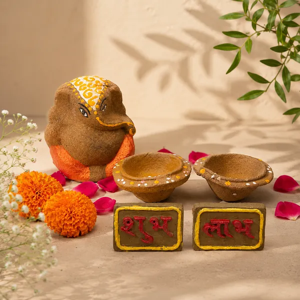 Traditional_Puja_Combo:_Gomay_Ganesh_Ji_4''_+_Cow_Dung_Diya_-_A_Set_Of_12_+_Sticker_Shubh_Labh