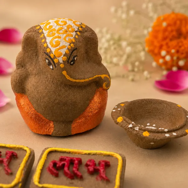 Traditional_Puja_Combo:_Gomay_Ganesh_Ji_4''_+_Cow_Dung_Diya_-_A_Set_Of_12_+_Sticker_Shubh_Labh