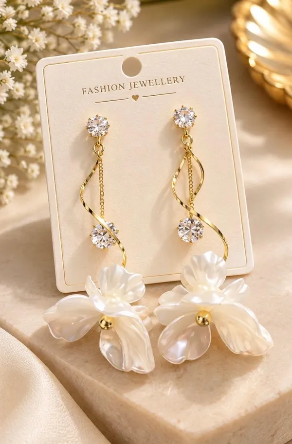 Elegant_Crystal_and_White_Flower_Dangle_Earrings