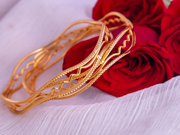 Gold_Metal_Wavy_Dotted_Patterned_Bangles_For_Women