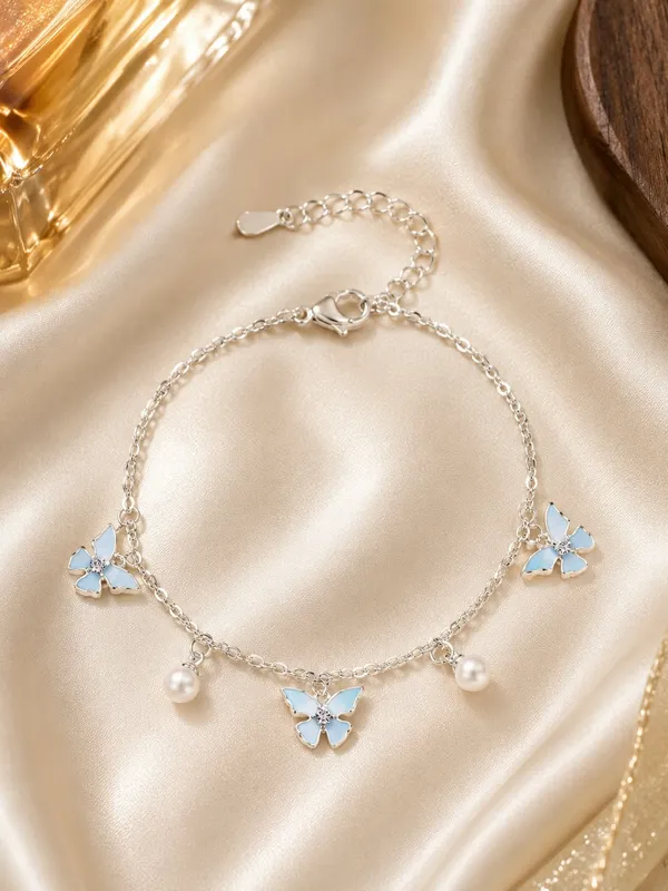Elegant_Silver_Tone_Butterfly_Charm_Bracelet_For_Women_With_Blue_Enamel_Butterfly_Charms_Pearl_Dangle_Accents_And_Delicate_Chain_Design_Adjustable_Fashion_Jewellery_For_Party_Casual_Festive_And_Everyday_Wear