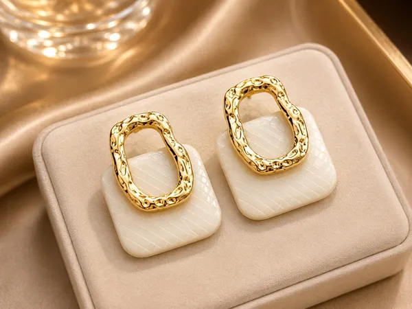 Gold_Earrings_For_Women_Oval_Shiny_Hollow_Design_With_Textured_Surface_For_Everyday