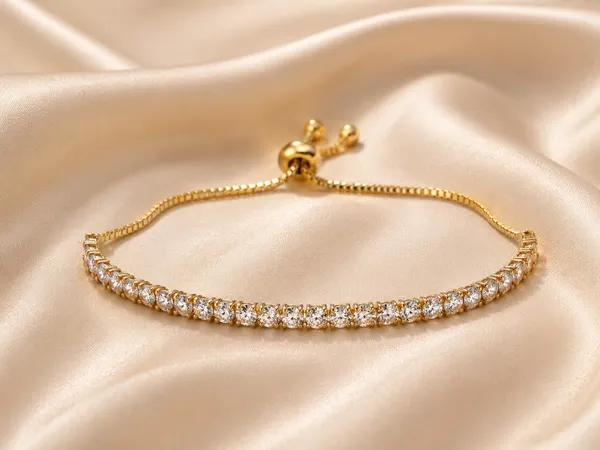 Elegant_Gold_Tone_Adjustable_Tennis_Bracelet_For_Women_With_Sparkling_Round_Crystal_Stones_Slim_Chain_Design_And_Sliding_Bolo_Clasp_Stylish_Fashion_Jewellery_For_Party_Wedding_Festive_And_Everyday_Wear
