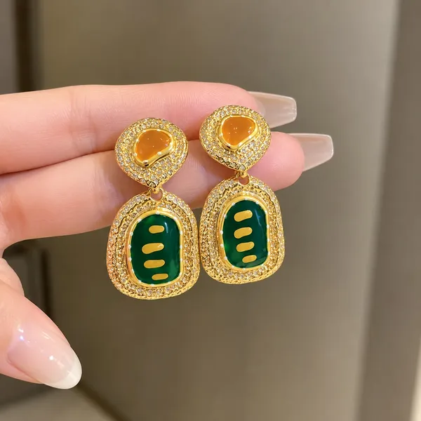 Elegant_Green_And_Golden_Drop_Earrings_For_Women_Premium_Geometric_Design_With_Green_Enamel_Detailing_Amber_Center_Stones_And_Sparkling_Crystal_Border_Trendy_Statement_Fashion_Jewellery_For_Party_Wedding_And_Festive_Wear